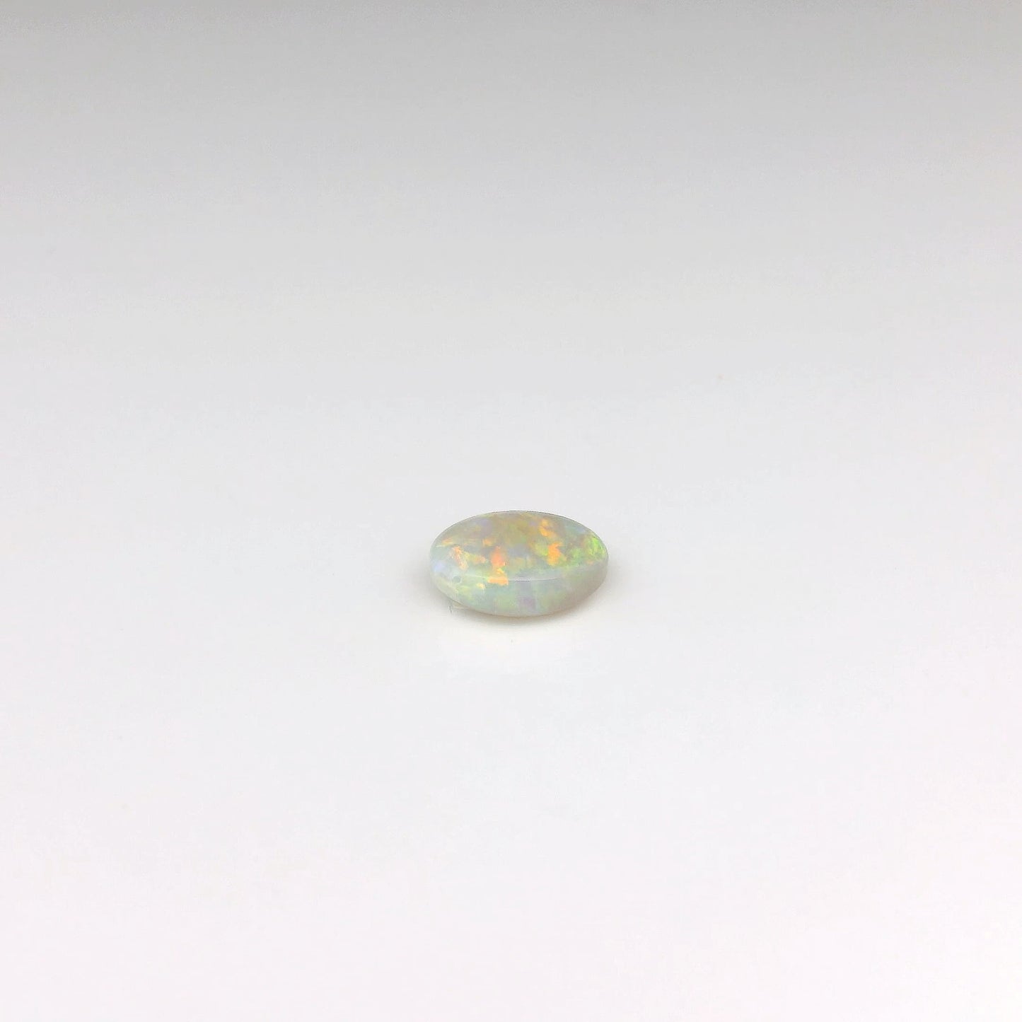 0.80ct Green, Orange Opal Gemstone