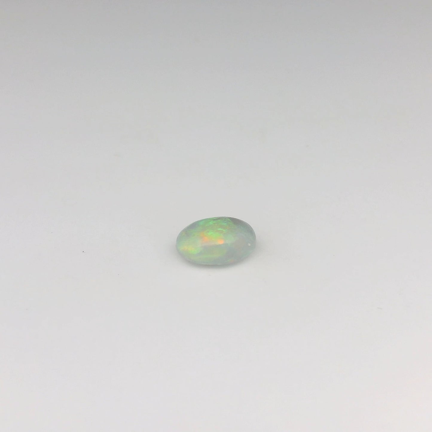 Bespoke 0.70ct Green, Orange Opal Ring
