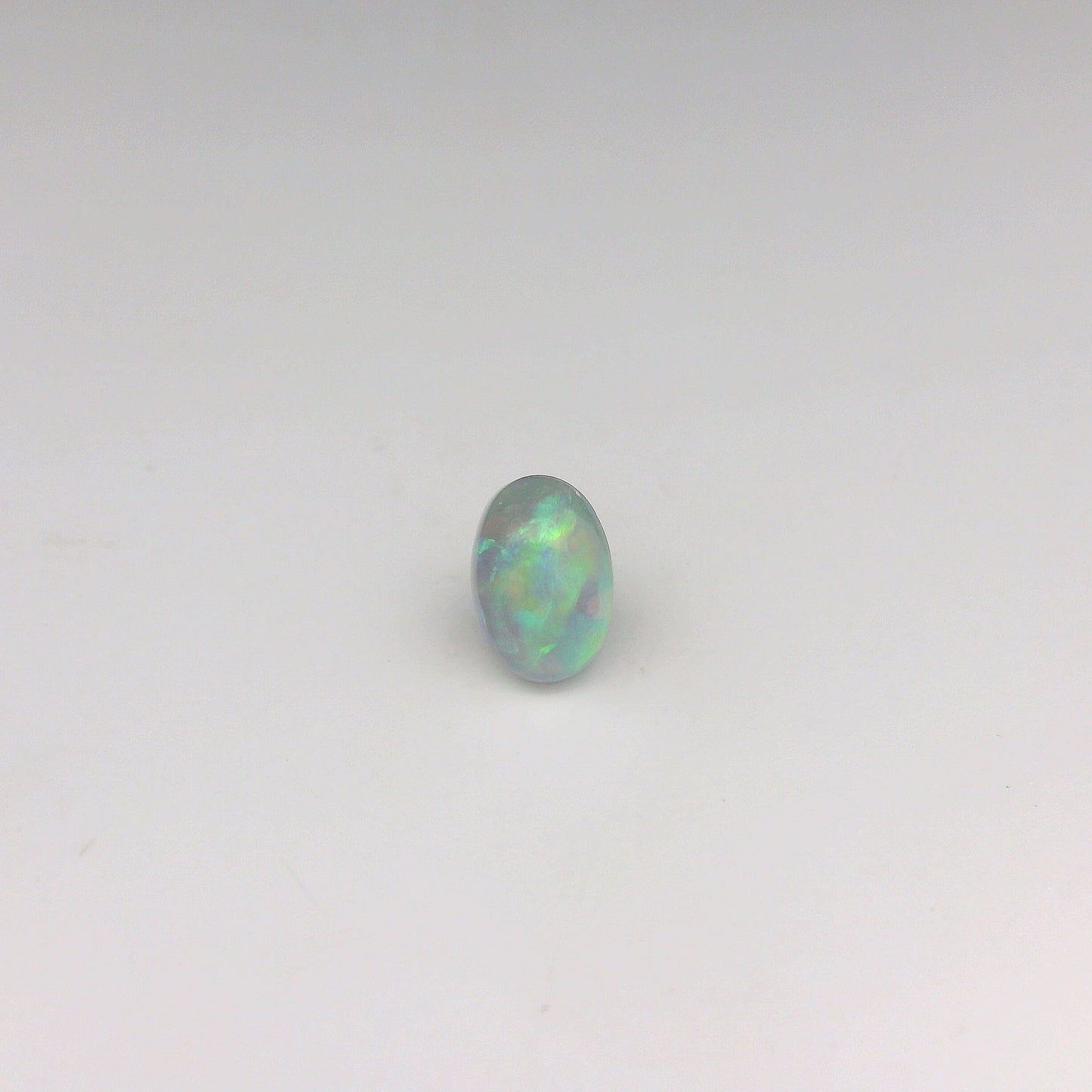 Bespoke 0.70ct Green, Orange Opal Ring