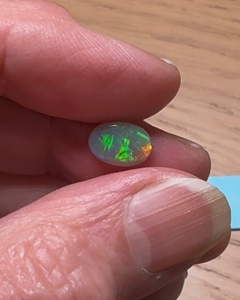 Op maat gemaakte 1,25ct oranje, groene opaal ring 