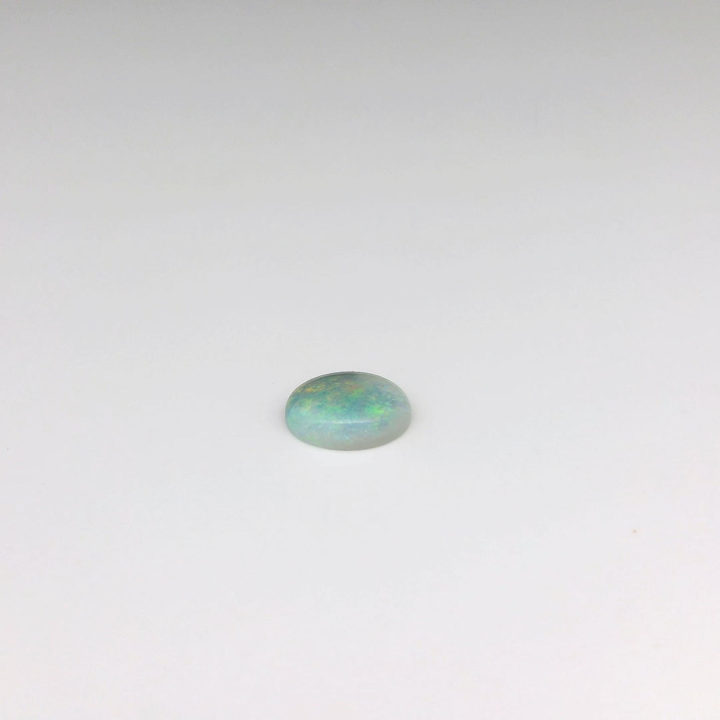 Bespoke 0.78ct Green, Orange Opal Pendant